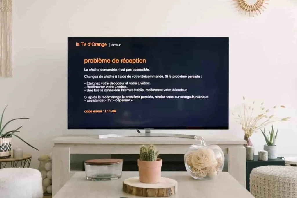Illustration du code erreur l11-06 sur une box TV Orange avec solutions.
